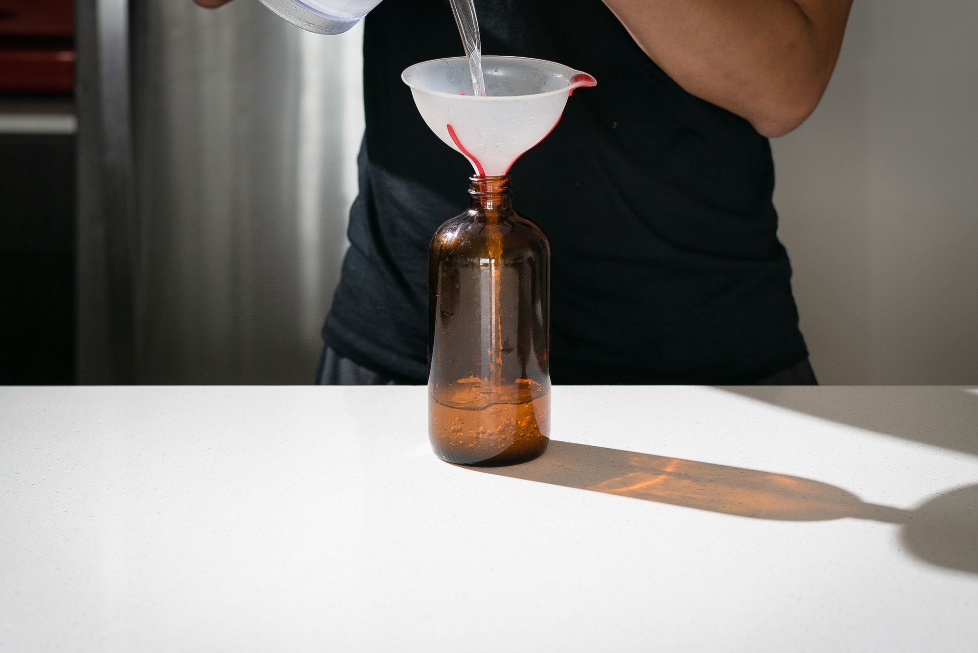 pour simple syrup into container